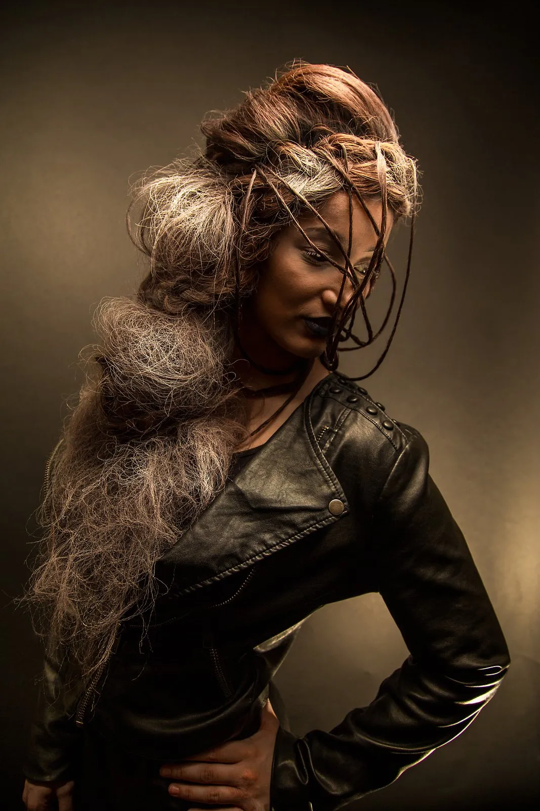 Dramatic gold and black styling against a dark ground