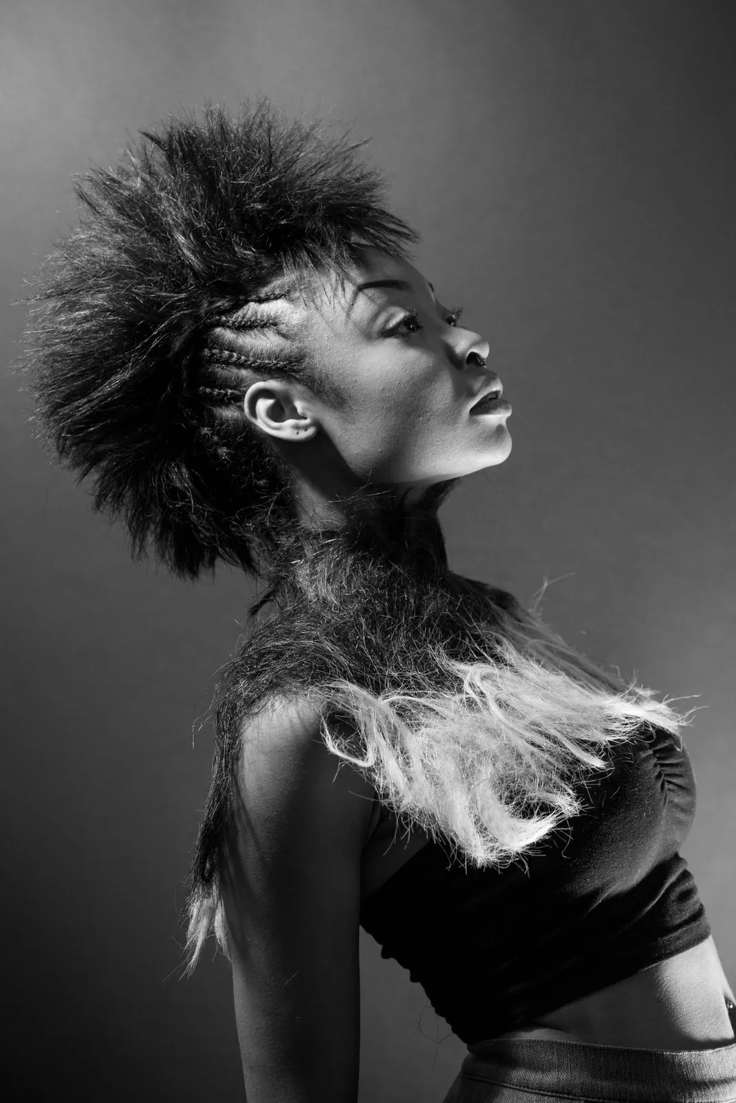 Sculpted hair and strong side light, studio