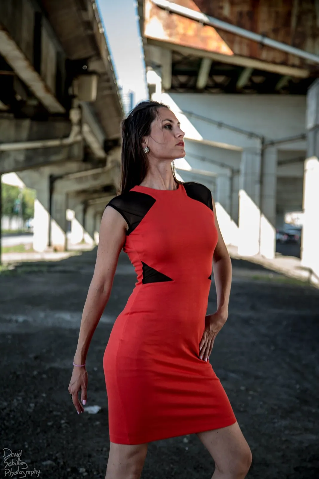 Red dress on a city street in daylight